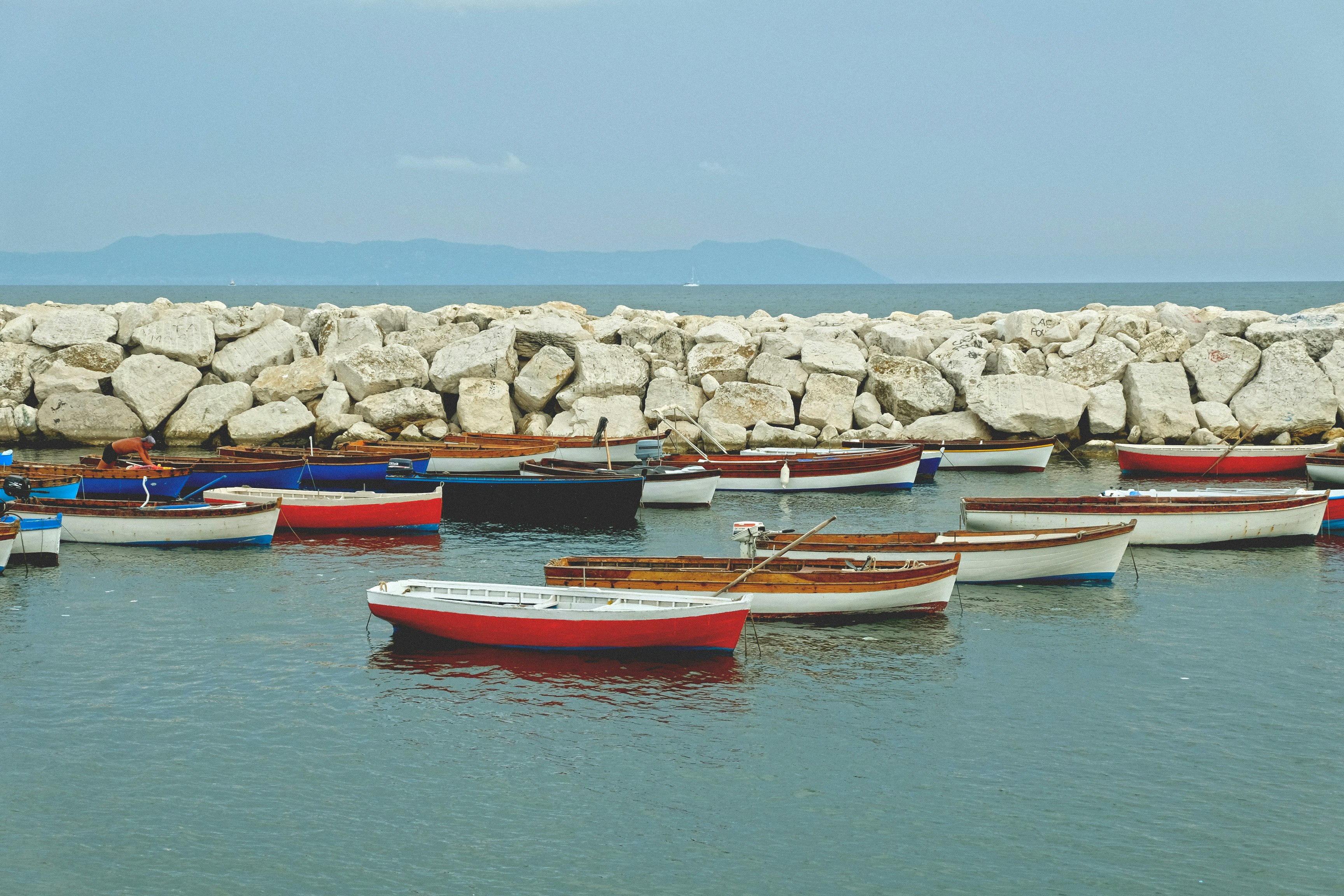 boats dock near the rocks